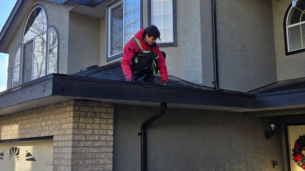 Clogged-Gutters-Expensive-Repairs-Here's-How-to-Prevent-It Clogged gutters overflowing with rainwater causing potential roof and foundation damage