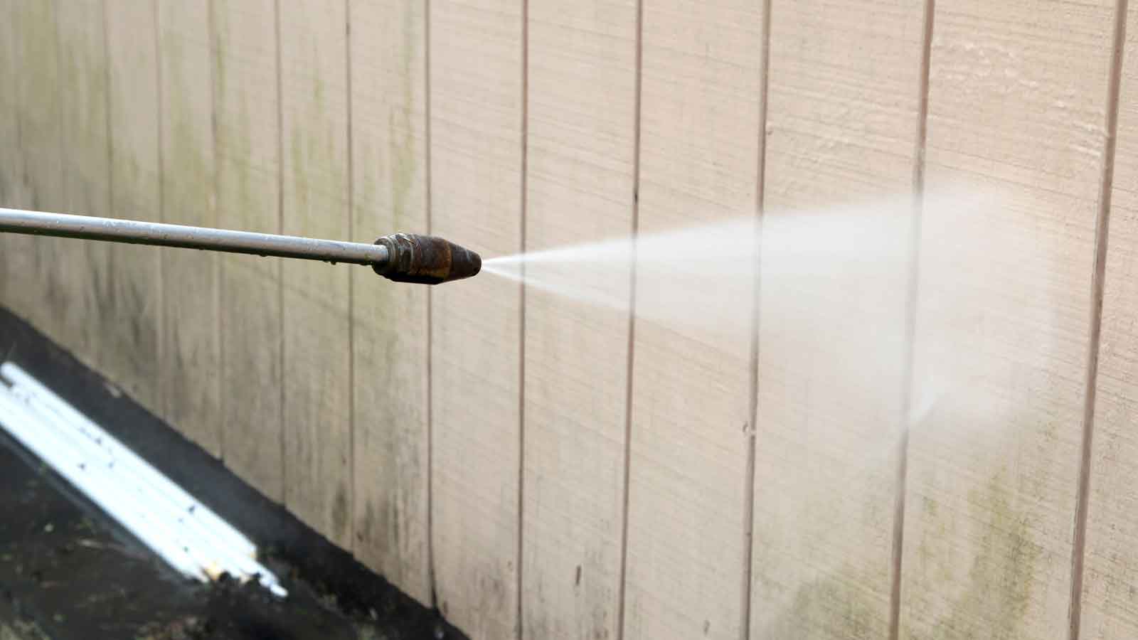 Maple Washing pressure washing a fence during stage 2 water restrictions.